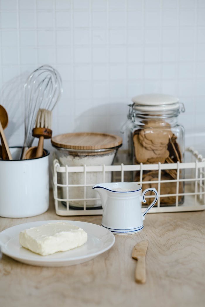 A cozy kitchen counter with baking ingredients and utensils, perfect for home cooks.